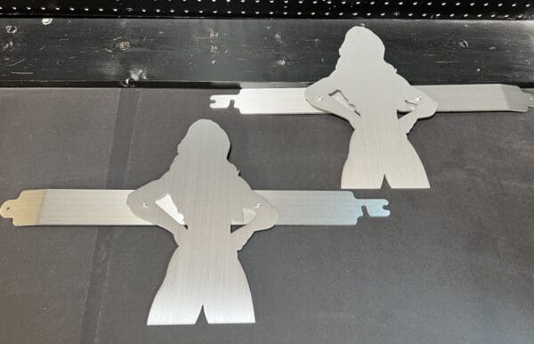 Two metal cutouts of a man and a woman