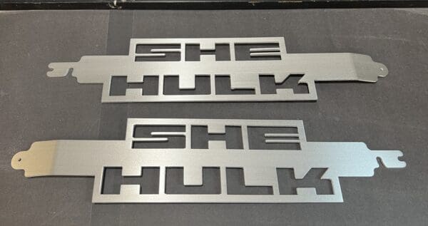 A metal sign that says she hulk she hulk