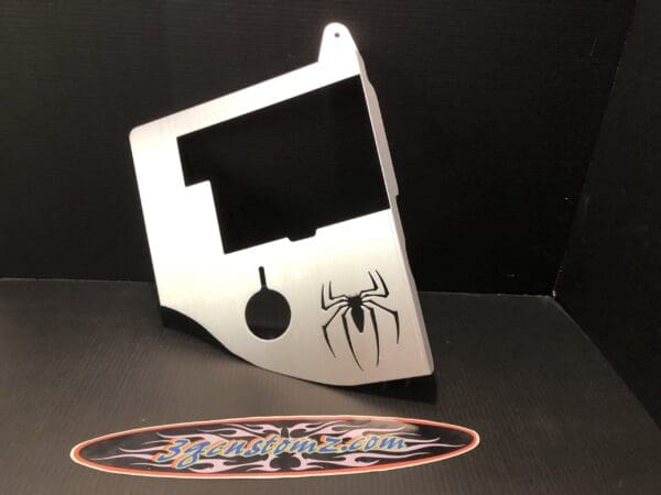 An ABs cover featuring a cutout of a spider symbol, resembling the Spiderman logo.