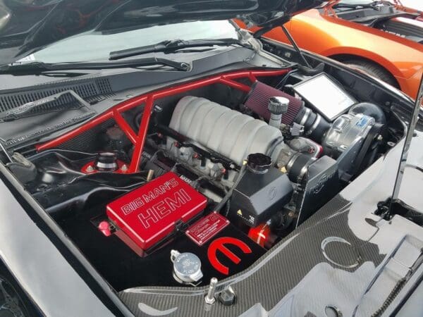 The engine compartment of a car with the hood open