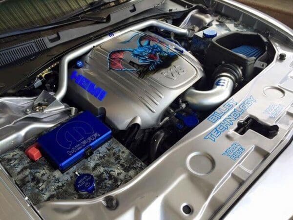 The engine compartment of a car with its hood open