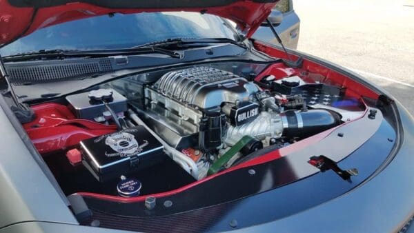 The engine of a sports car with its hood open