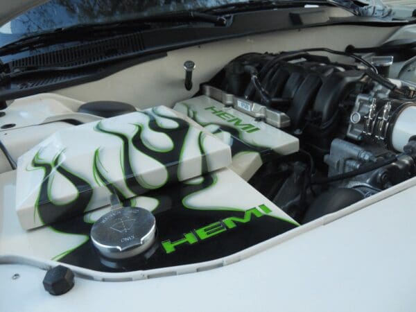 The engine compartment of a car with the hood up