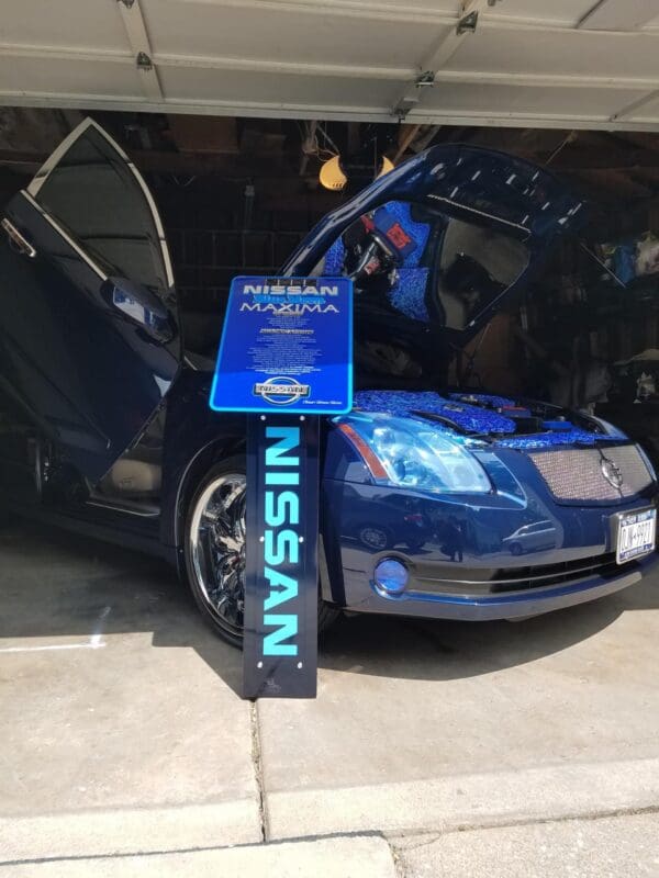 A blue car is parked in a garage