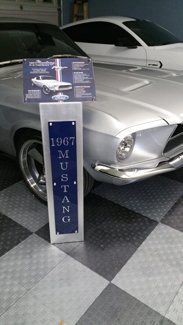 A silver mustang sitting on top of a checkered floor