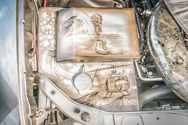 A close up of a car engine with drawings on it