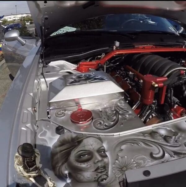 The engine of a car with a clown face on it