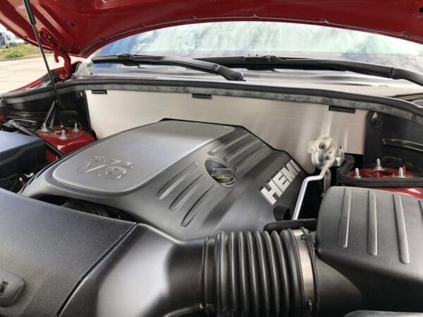 The engine of a car with its hood open