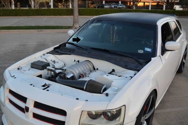 A white car parked in a parking lot