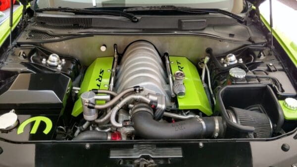 The engine compartment of a car with its hood open