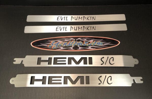 A set of three metal name plates on a table