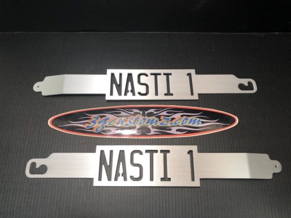 A close up of two license plates on a table