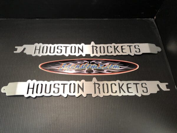 Two stickers that say houston rockets and houston rockets