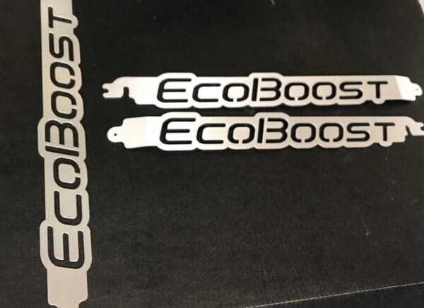 A close up of two stickers on a table