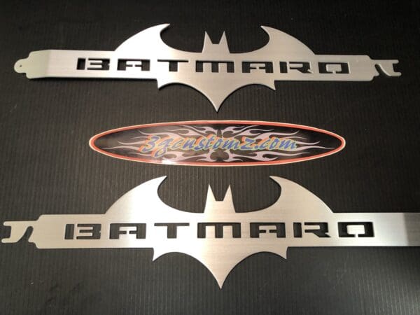 A batman logo is shown on a table