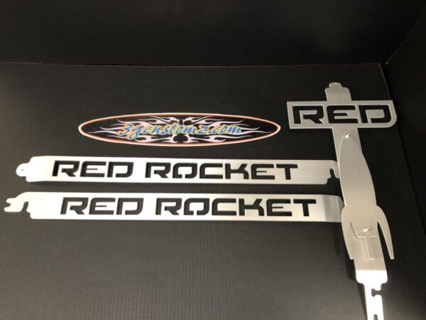 A pair of red rocket and red rocket stickers