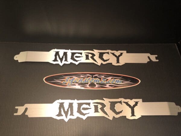 Two metal signs that say merry and merry