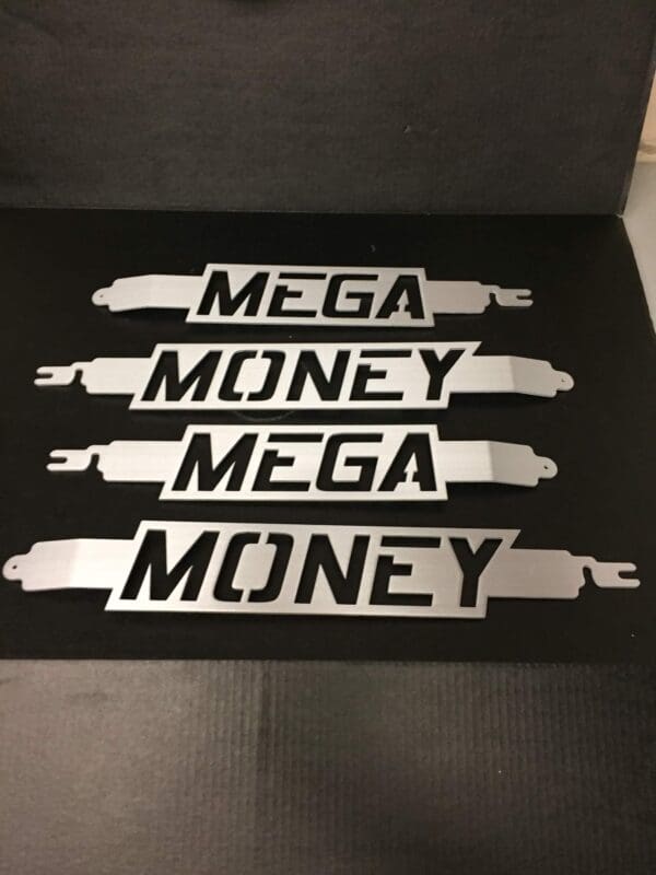 Three stickers that say mega money and mega money