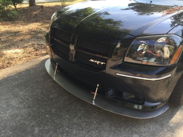 A black car parked on the side of the road