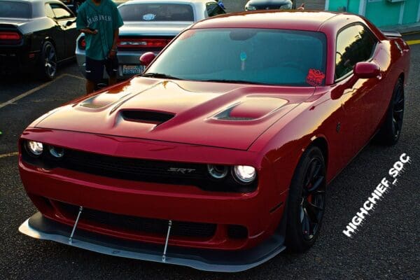 A red sports car parked in a parking lot