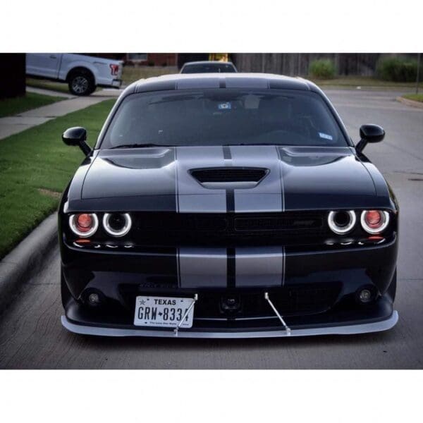 A black and white striped car parked on the street