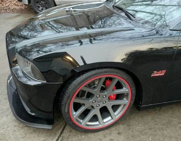 A black sports car parked on the side of the road