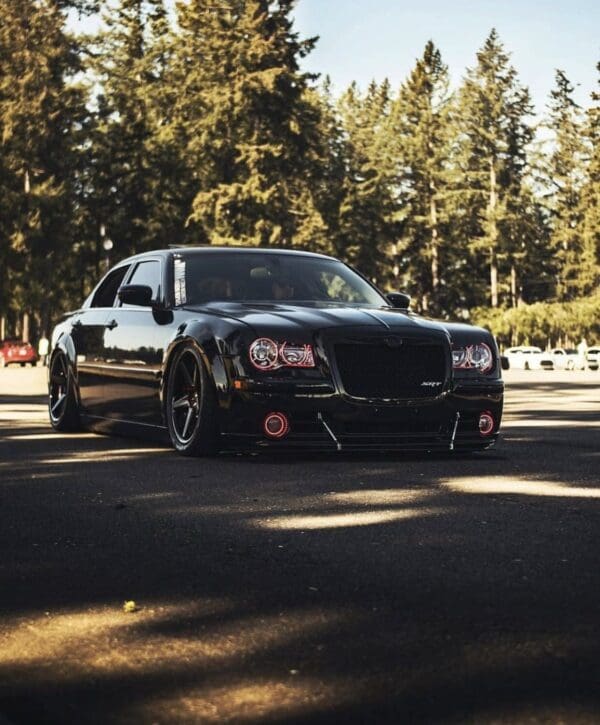 A black car parked on the side of a road