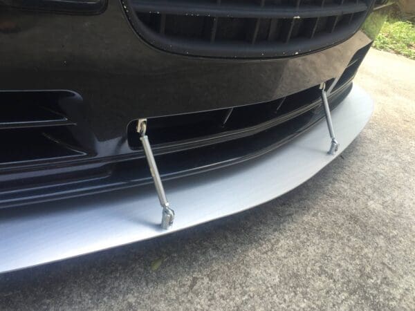 The front bumper of a black sports car