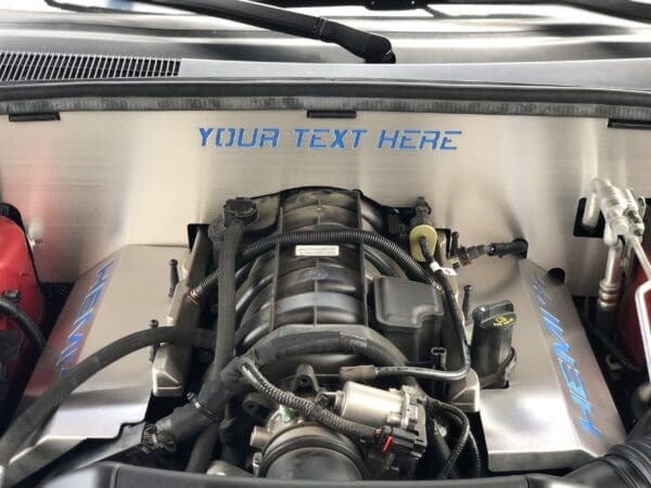 Open car hood revealing a HEMI engine with "YOUR TEXT HERE" on the engine bay cover.