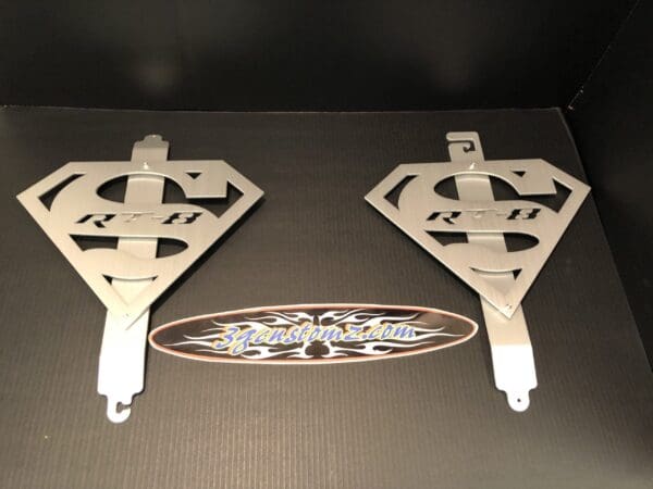 2 metal hood prop with the SUPERMAN logo