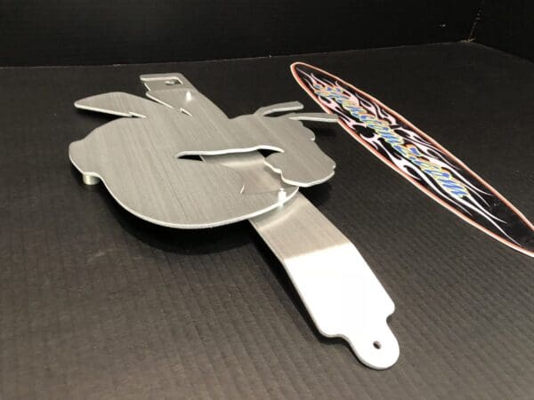A metal hood prop with a custom design