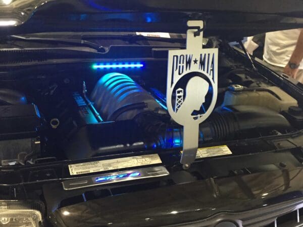 A close up of a car with its hood up