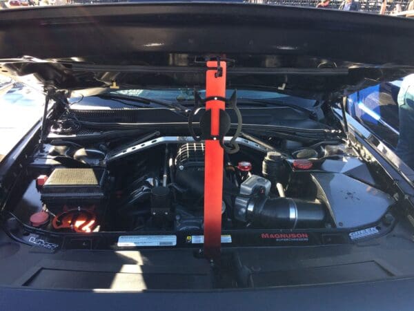 The engine compartment of a car with its hood open