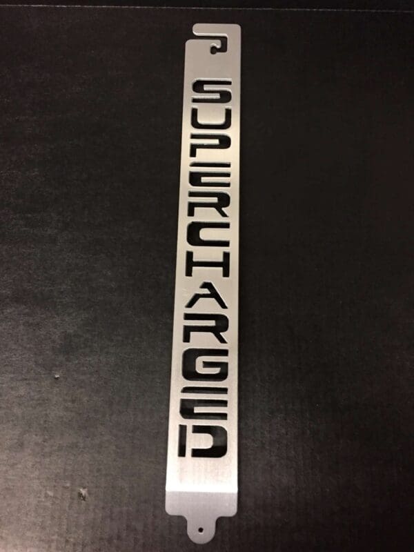 A metal hood prop with the PUNISHER logo designed on it