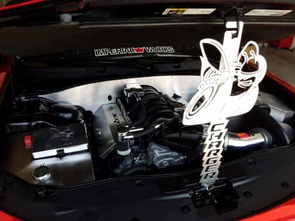 The engine compartment of a red sports car
