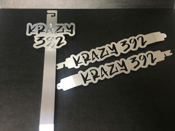 3 metal hood prop with the words KRAZY 392