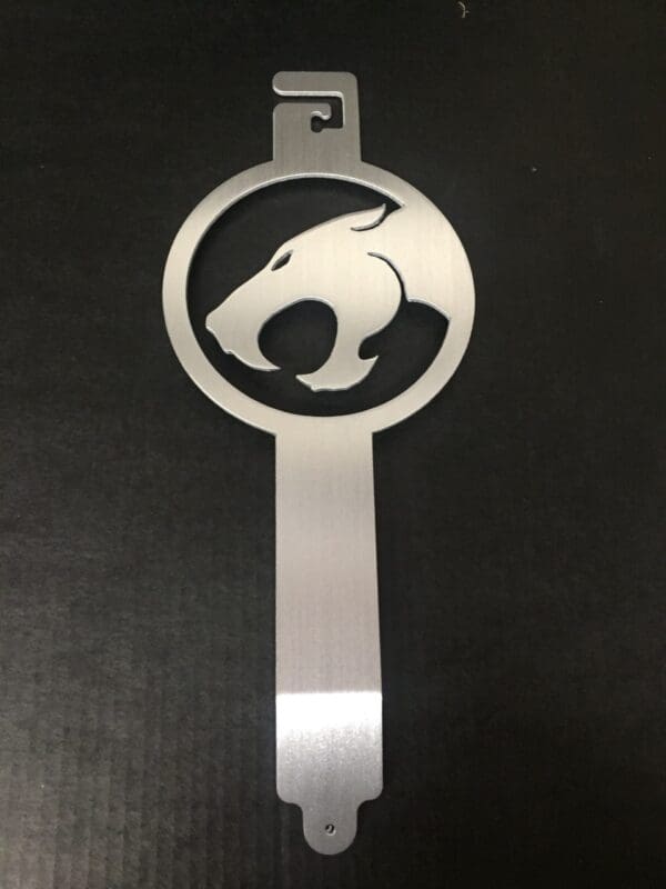A metal hood prop with the Thundercats logo