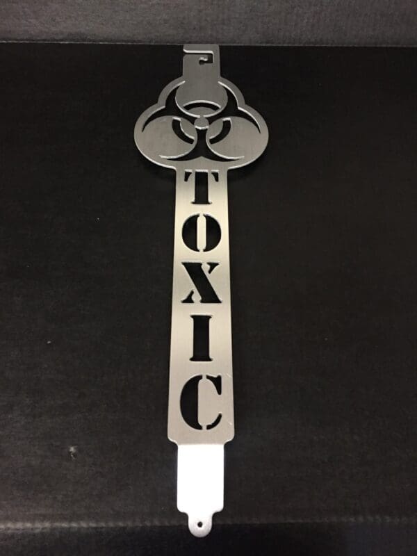 A metal hood prop with the word TOXIC on it