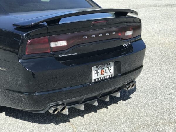 A black sports car parked in a parking lot