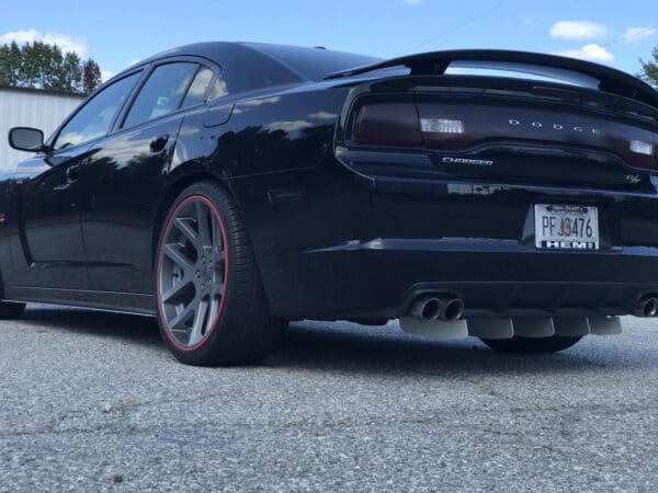 A black car parked in a parking lot