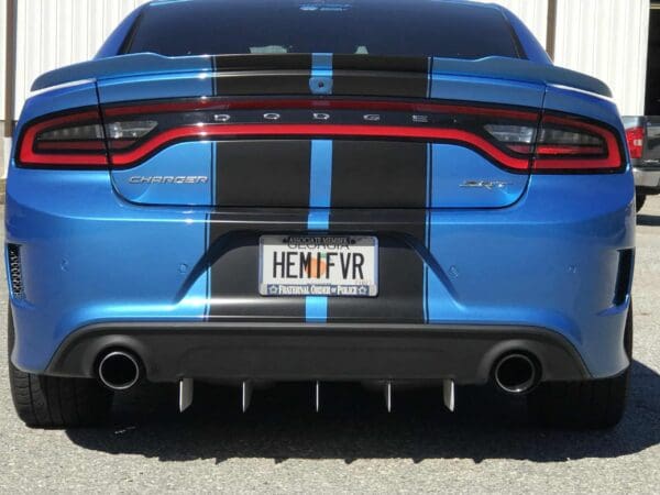 Rear view of a blue Dodge Charger SRT with black racing stripes and a license plate reading "HEMIFVR."