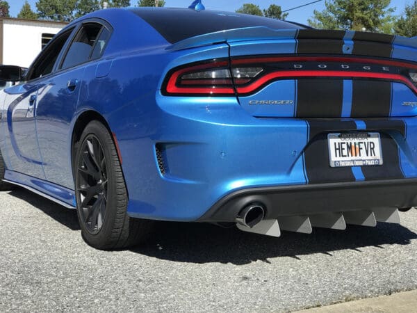 A blue dodge charger parked in a parking lot