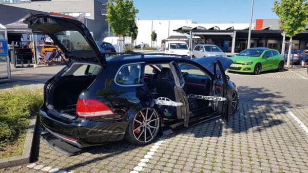 A couple of cars parked next to each other on a street