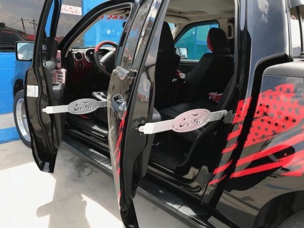 A black van with red and black designs on it