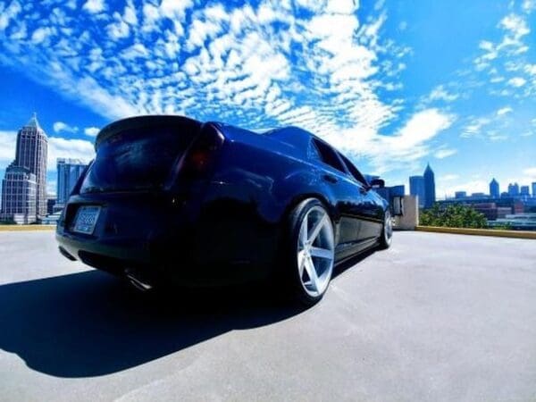 A black sports car parked in a parking lot