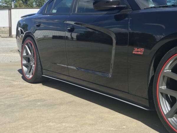 A black sports car parked in a parking lot