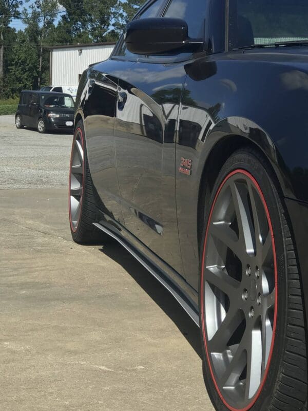 A black sports car parked in a parking lot