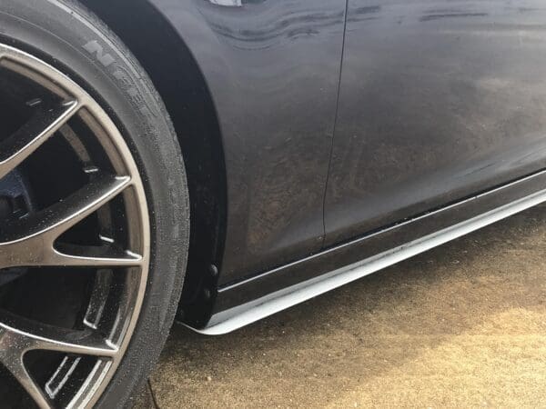 A close up of a car tire on a street