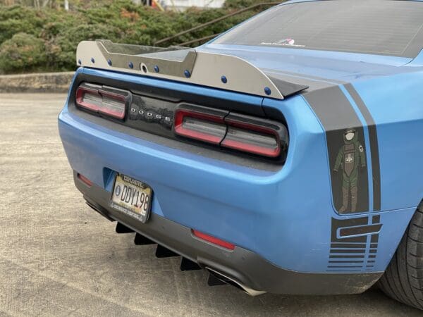 A blue sports car parked in a parking lot