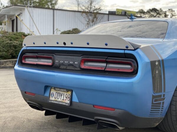 A blue sports car parked in a parking lot